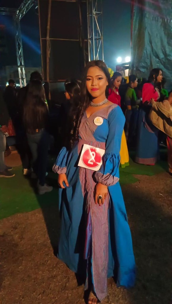 Pageant contestant in a custom blue Womania gown