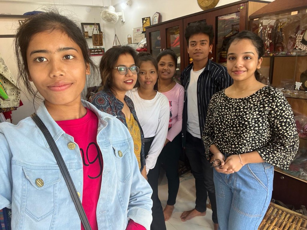 Interns smiling together inside the studio