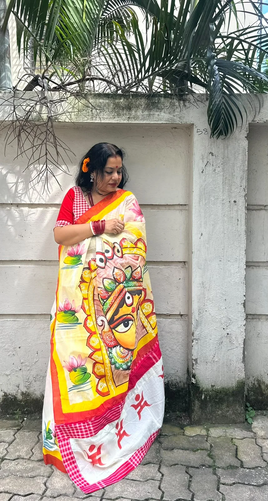 Maa Durga Motif handpainted cotton saree with gamcha border Saree length:5.5 mtr Doesn’t come with a blouse piece