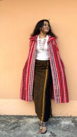 Tribal fabric long shrug with collar and pockets .