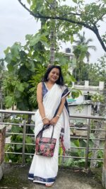 White cotton saree with indigo border and lace work